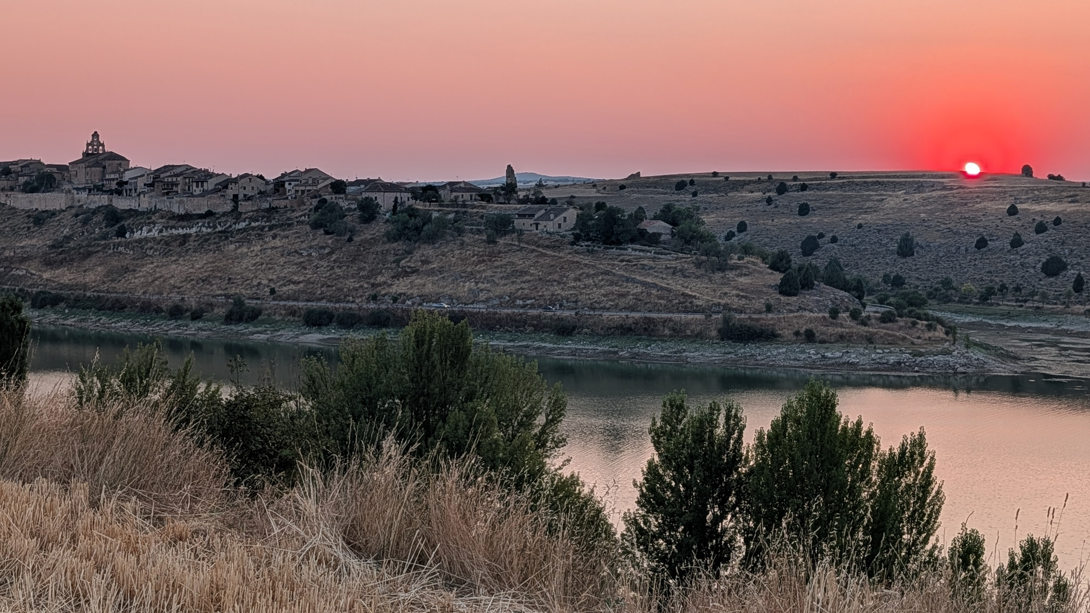 Partial eclipse sunset over Maderuelo